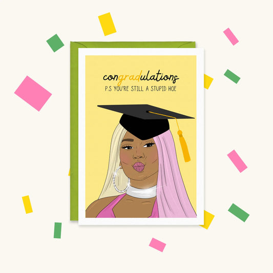 Greeting card of Nicki Minaj in a grad cap, pink and blonde hair, reading 'congradulations, you're still a stupid hoe'