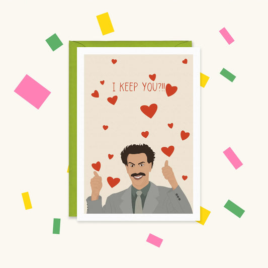 Greeting card of Borat in a grey suit giving two thumbs up surrounded by red hearts, with text "I KEEP YOU?!!"