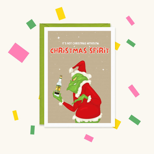 Greeting card of the Grinch in a Santa suit holding a bottle of white rum, text "It's not Christmas without... Christmas spirit"
