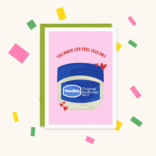 Greeting card of a Vaseline jar with red hearts on pink, reading "You make life feel less dry"