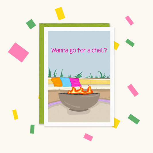 Greeting card of a Love Island-style villa fire pit with colourful cushions, reading "Wanna go for a chat?"