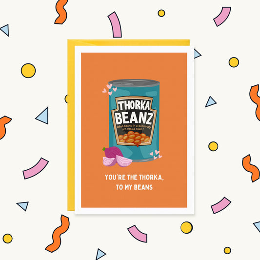 Greeting card of a Heinz-style 'Thorka Beanz' tin with onion and hearts, reading 'You're the thorka, to my beans'