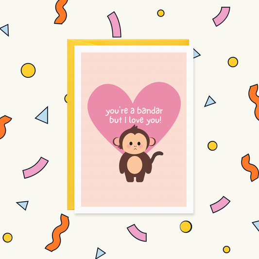 Greeting card with a cute grumpy monkey in front of a pink heart, reading "you're a bandar but I love you!"