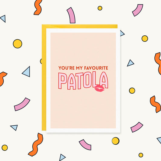 Greeting card on a peach background with a pink lipstick kiss and the text "You're my favourite Patola"