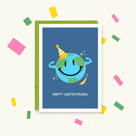 Greeting card with a smiling Earth flexing its arms in a party hat among stars, text "Happy Earthstrong"