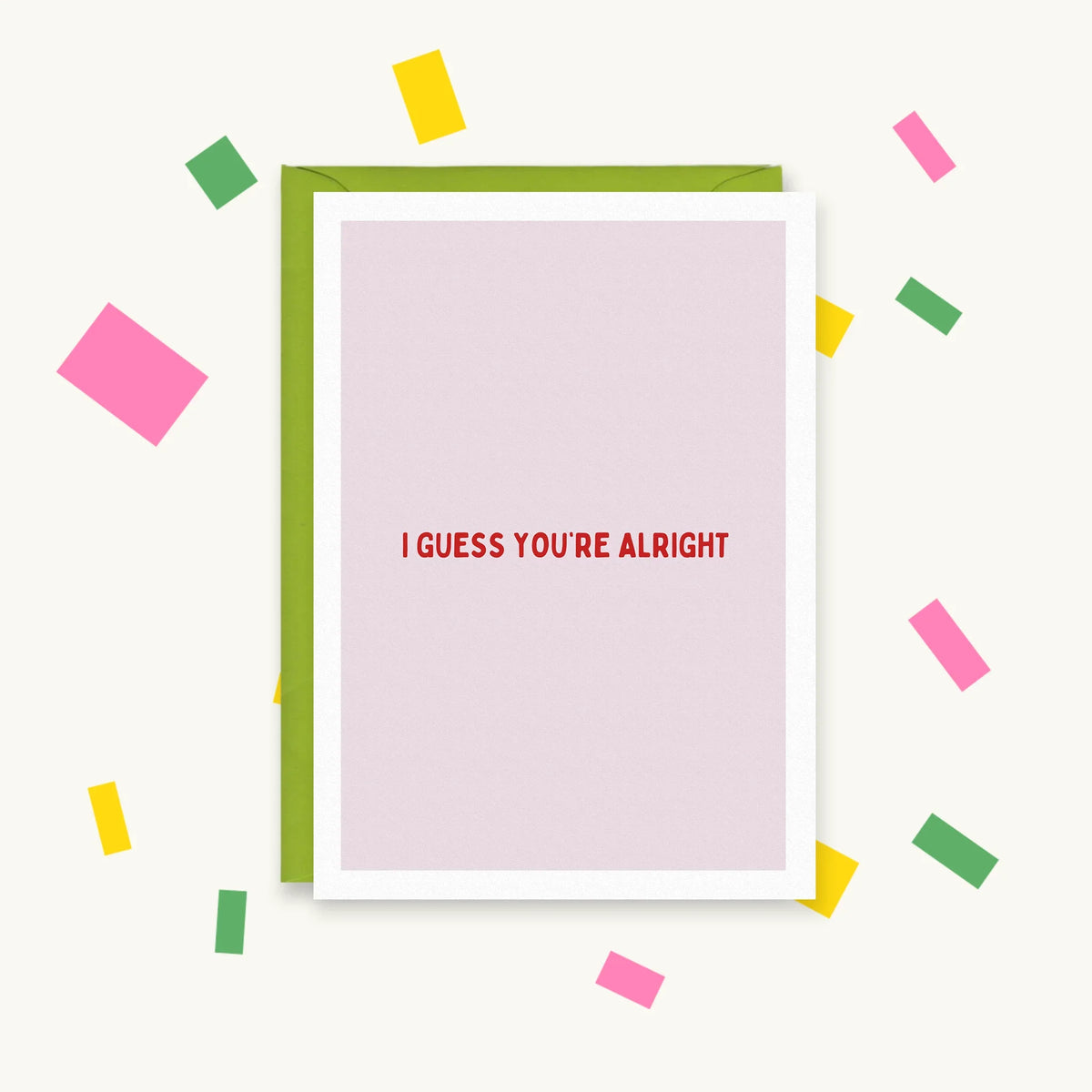 Greeting card with plain pink background and red capital text reading "I guess you're alright"