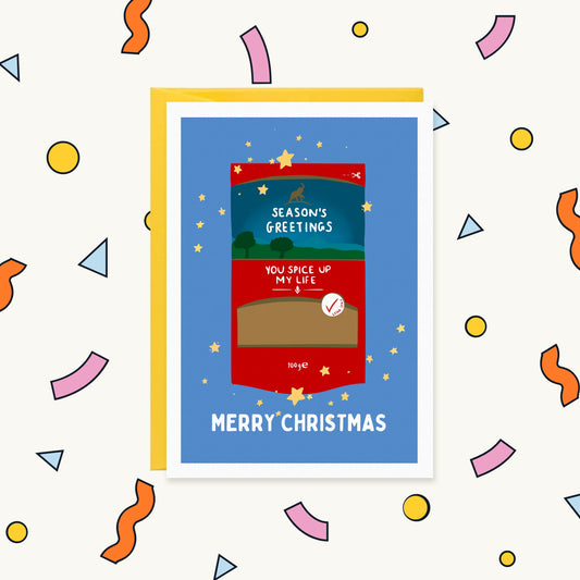 Greeting card of a red desi spice packet with gold stars, reading "You spice up my life" and "Merry Christmas"