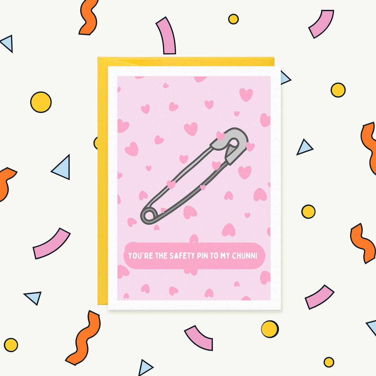 Greeting card with a silver safety pin on a pink heart pattern reading "You're the safety pin to my chunni"