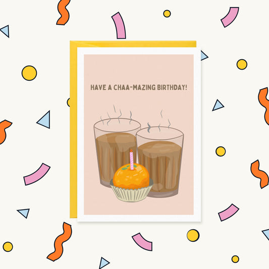 Greeting card with two glasses of steaming chai and a ladoo with a candle, reading "Have a chaa-mazing birthday!"