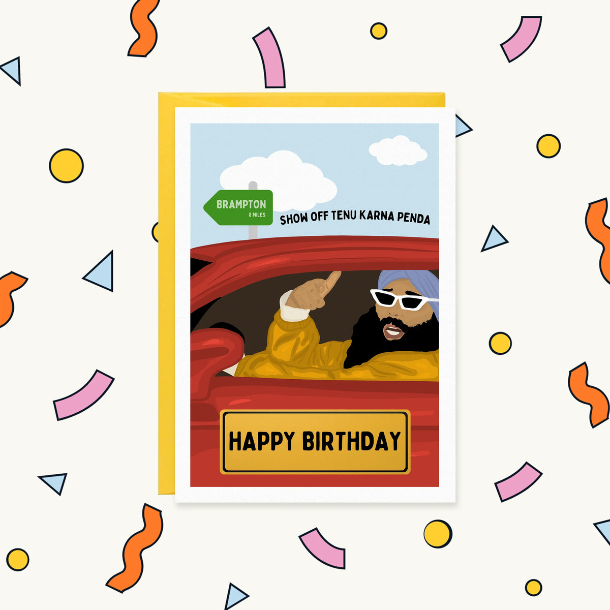 Greeting card of a turbaned Sikh man in shades driving a red car past a Brampton sign, 'Show off tenu karna penda'