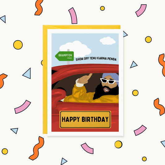 Greeting card of a turbaned Sikh man in shades driving a red car past a Brampton sign, 'Show off tenu karna penda'