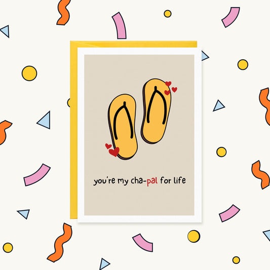 Greeting card with a pair of yellow flip-flop chappals and red hearts, reading "you're my cha-pal for life"