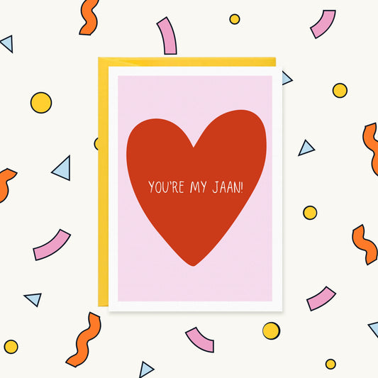 Greeting card with a large red heart on a pink background and the words "You're my jaan!" in white