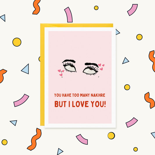 Greeting card with eyes rolling upward, eyeliner and pink hearts on pink, reading "You have too many nakhre but I love you!"